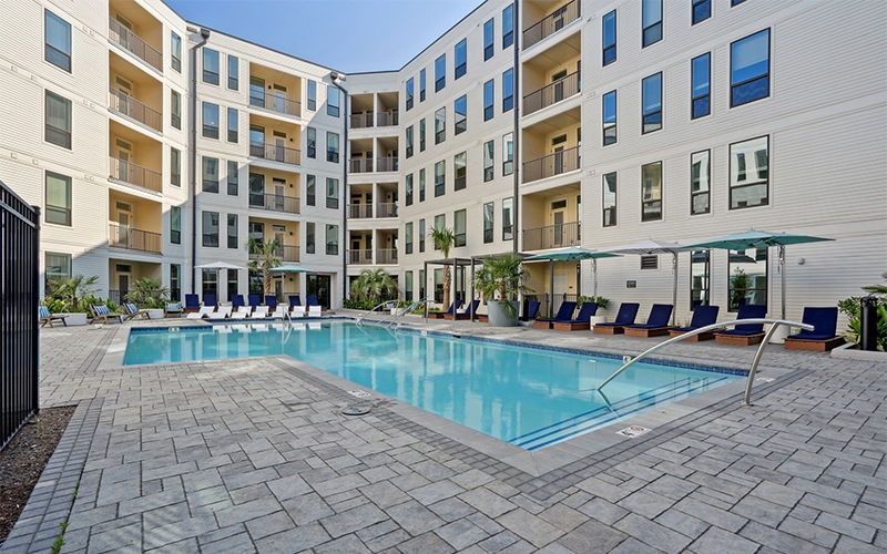 a pool with chairs around it