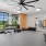 gym with exercise equipment and large fan