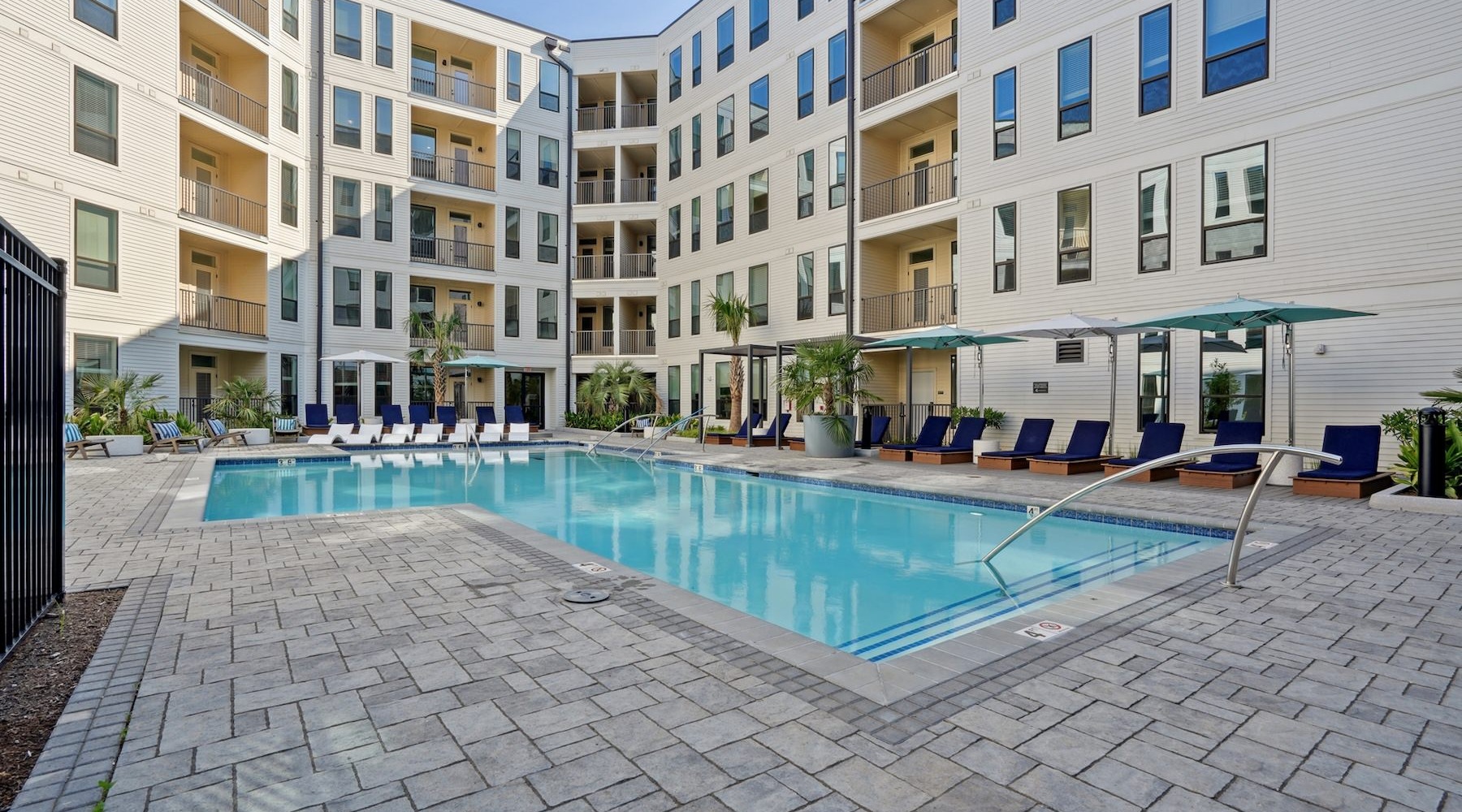 Resort-style swimming pool pool in a courtyard