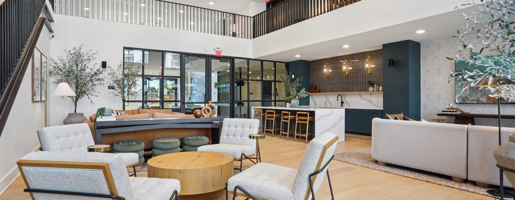 lounge with seating tables and large windows