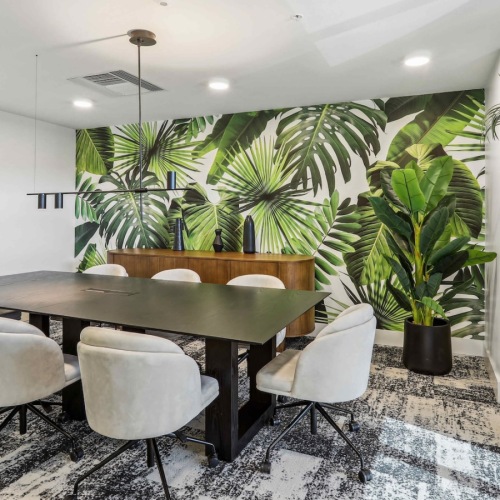 Conference rooms for collaboration conference room with plants a table and chairs