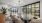 conference room with seating table and several windows