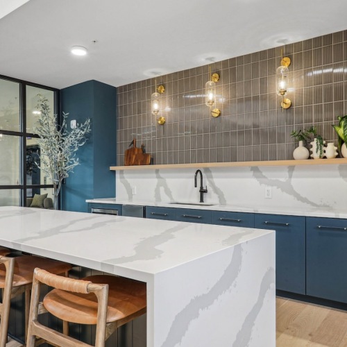 Exceptional spaces  community kitchen with seating table and windows