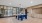 a table and seating in a room with windows