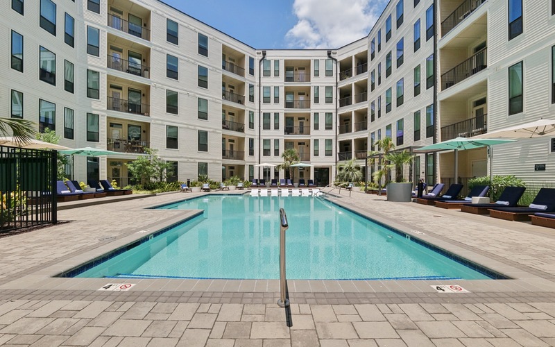 a pool with chairs around it